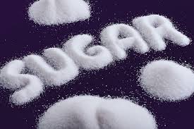 The word ‘Sugar’ spelled out in white sugar